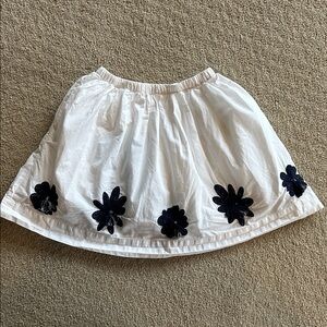 Elegant White Skirt with Black Floral Accents